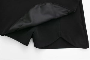 Black fabric with a satin lining on a white background