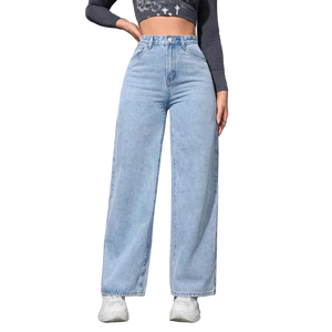 Person wearing light blue jeans against a gray wall