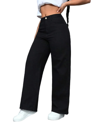 Person wearing black wide-leg pants and white sneakers against a gray wall.