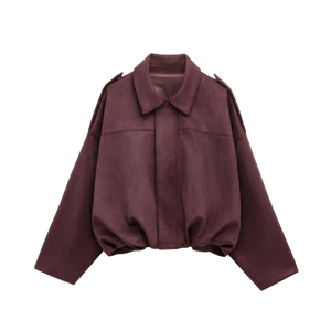 Effortlessly chic and oversized black bomber jacket with sophisticated collar and epaulet details.