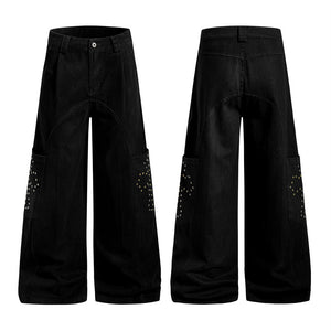 Black wide-leg pants with embellishments on a white background