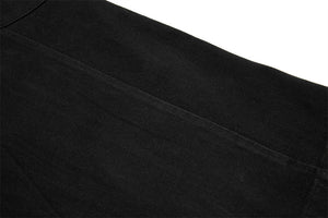Close-up of black fabric texture on a white background