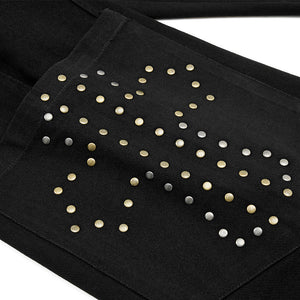 Black fabric with gold and silver studs on a white background