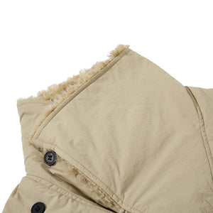 Close-up of a beige hooded jacket with sherpa lining on a white background