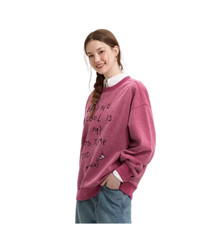 Person wearing a maroon sweatshirt with text on a plain background