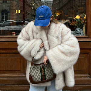 Rock this plush white faux fur jacket to bring a touch of luxury and cozy warmth to your everyday street style.