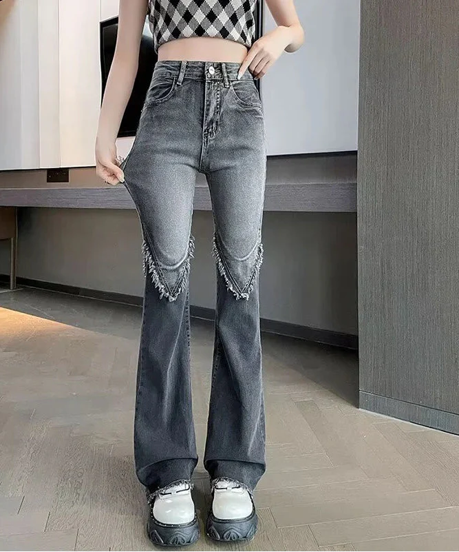 Vintage Schlagjeans mit Rissen und hohem Bund