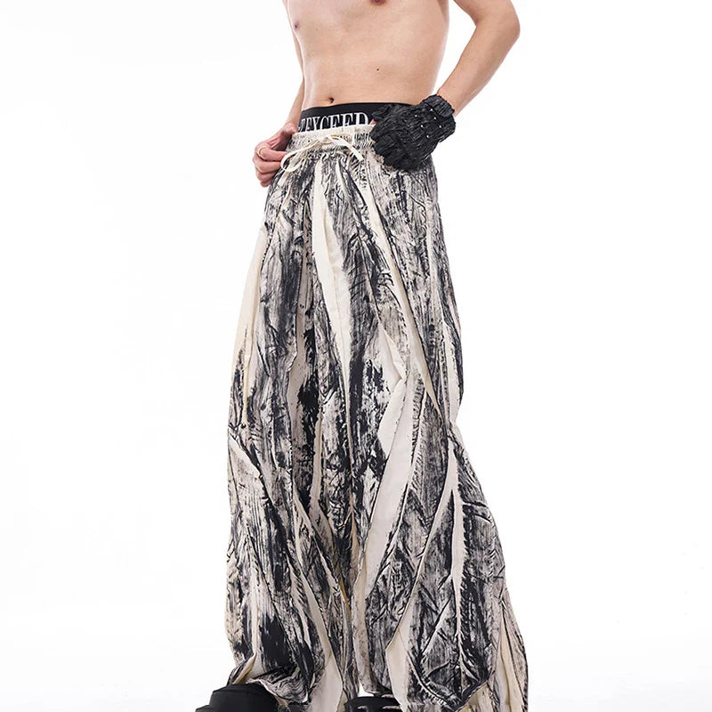 Pantalon plissé signature à jambes larges et amples