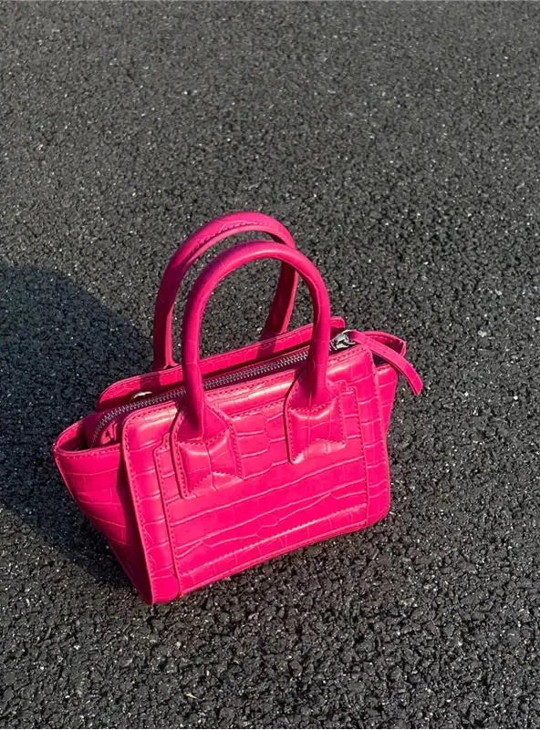 Sac seau vintage rose à motif crocodile