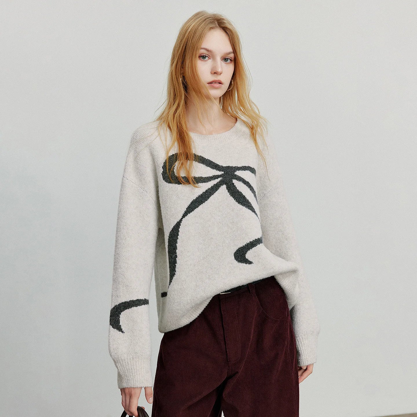 Pull femme jacquard à nœud papillon