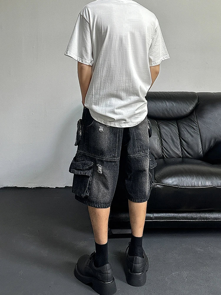 Short en jean noir à jambes larges et déchirées