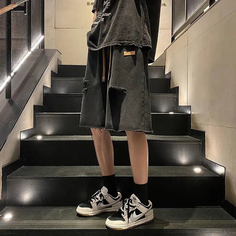 Short ample tendance avec poche zippée et bouton