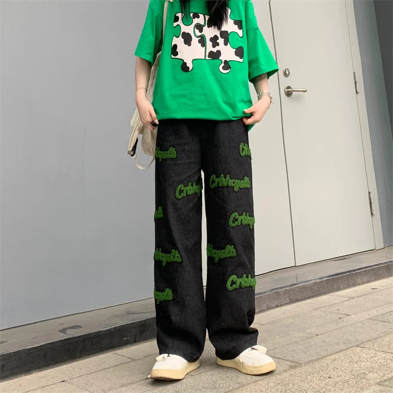 Elastische, hochgeschnittene Jeans mit Flockstickerei
