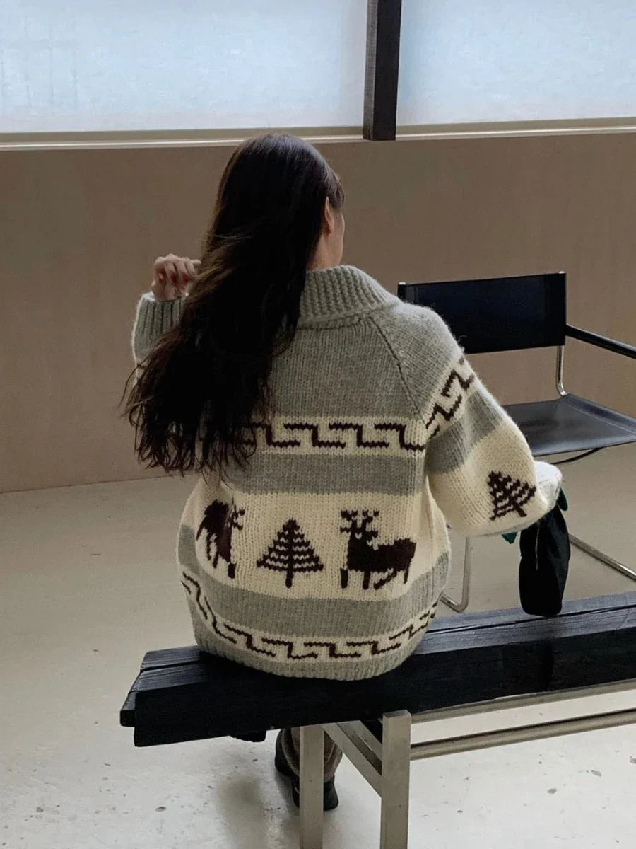 Gilet de Noël doux comme un nuage avec motif de rennes