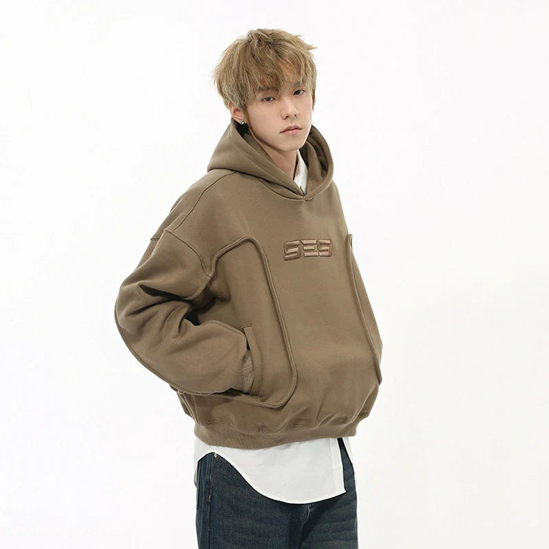 Bestickter, einfarbiger Hoodie im Decostruction-Stil