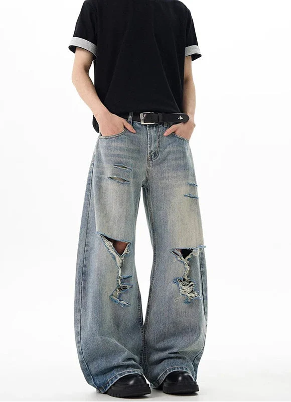 Vintage blaue Jeans mit Rissen und weitem Bein