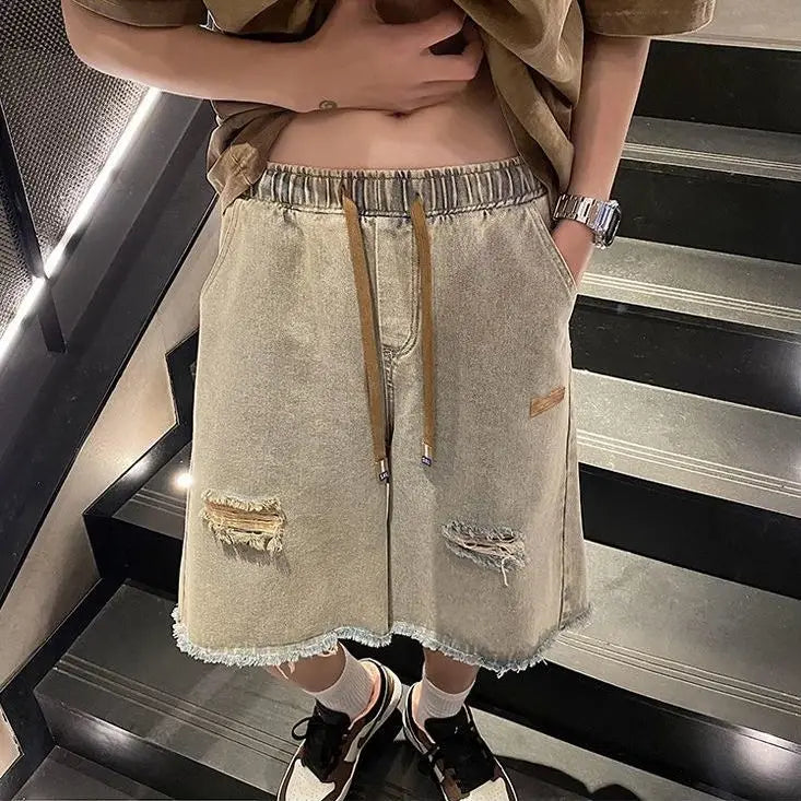 Short ample tendance avec poche zippée et bouton