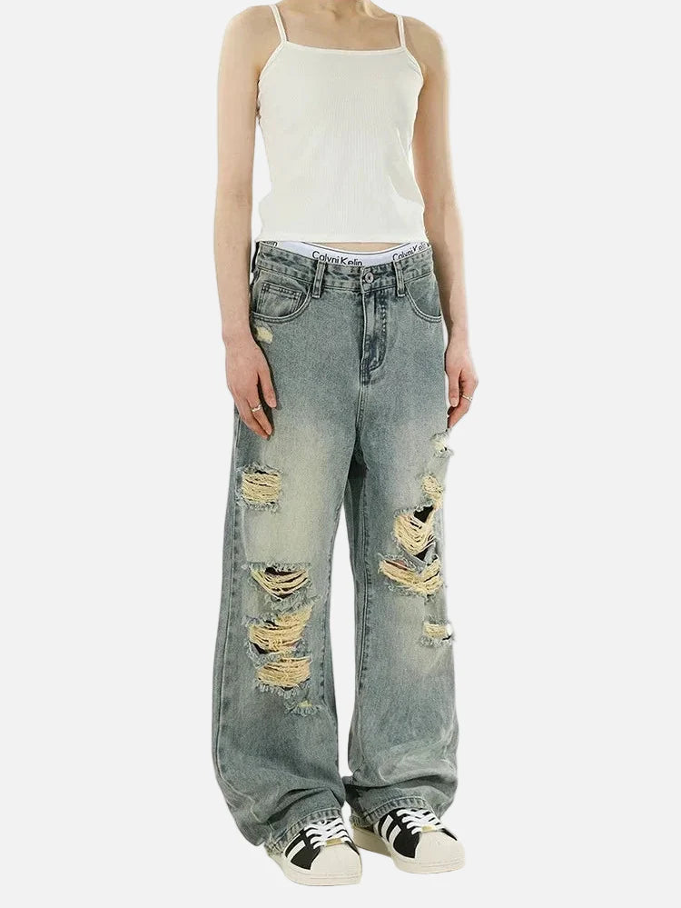 Y2K Strapazierfähige, im Used-Look gehaltene Schlagjeans aus Denim