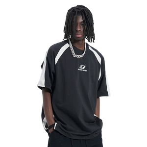Person wearing a black and white sports jersey with a brand logo on a white background