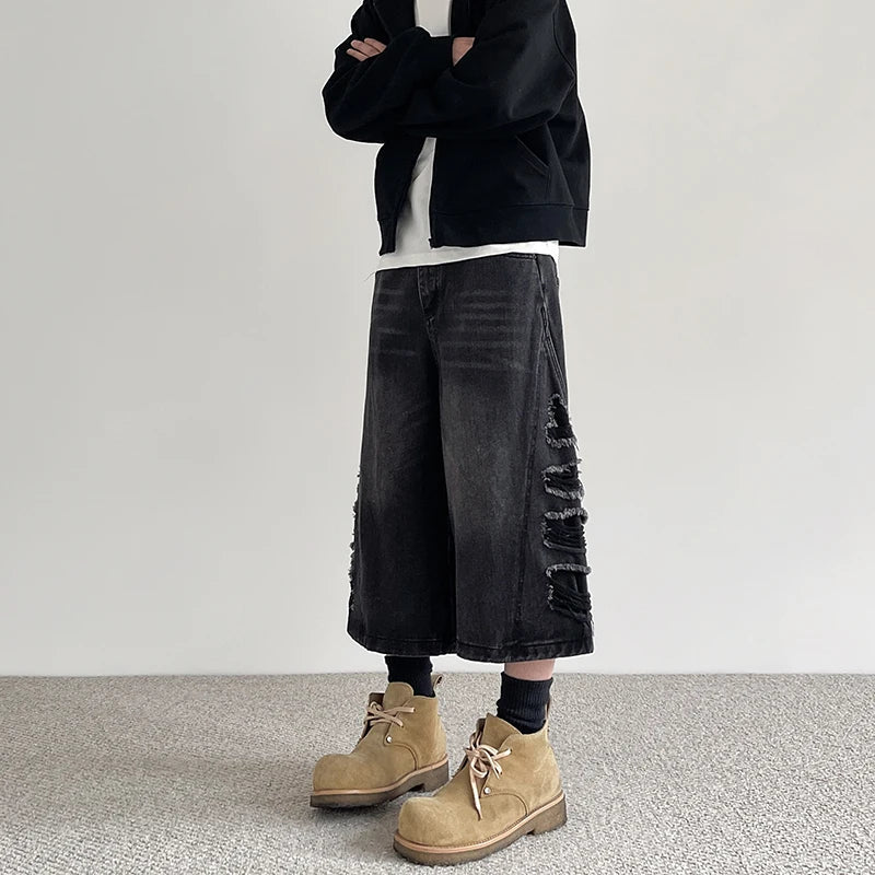 Schwarze, zerrissene, locker sitzende Jeans-Shorts im Vintage-Stil