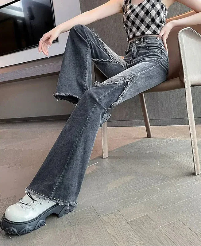 Vintage Schlagjeans mit Rissen und hohem Bund