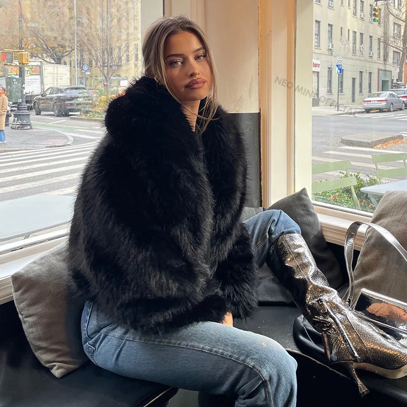 Style yourself in this luxurious black faux fur jacket, designed with an ultra-plush texture and voluminous collar for the ultimate glamorous streetwear statement.