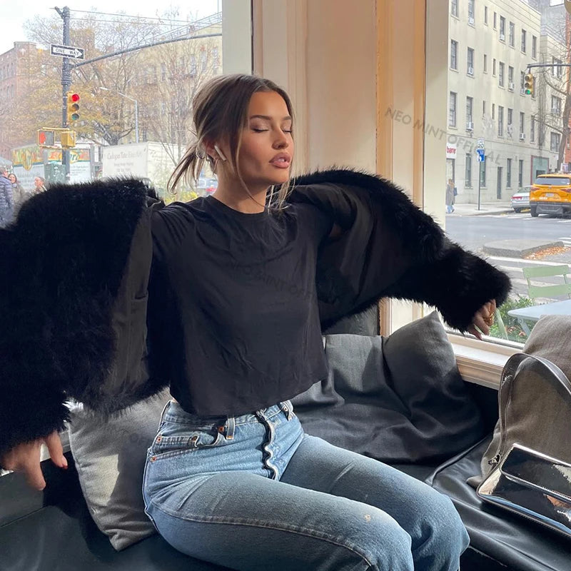Style yourself in this luxurious black faux fur jacket, designed with an ultra-plush texture and voluminous collar for the ultimate glamorous streetwear statement.