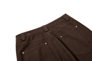 Brown pants with buttons on a white background