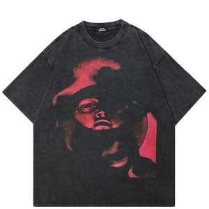 Black t-shirt with red graphic design on a white background