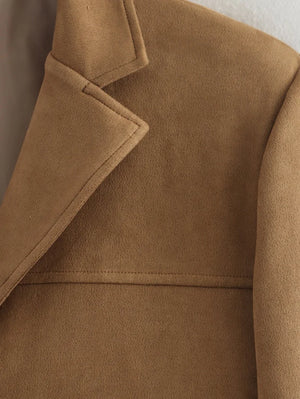 Close-up of a brown coat with a collar
