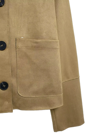 Close-up of a beige jacket with button details on a white background