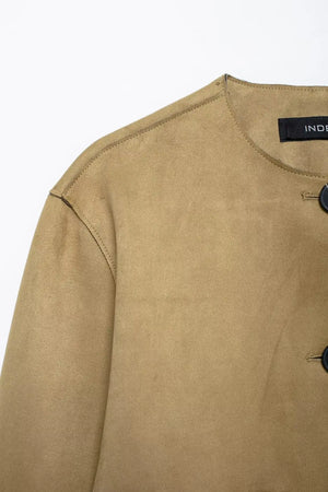 Beige sweater with a brand label on a white background