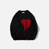 Pullover mit blutendem Herzen