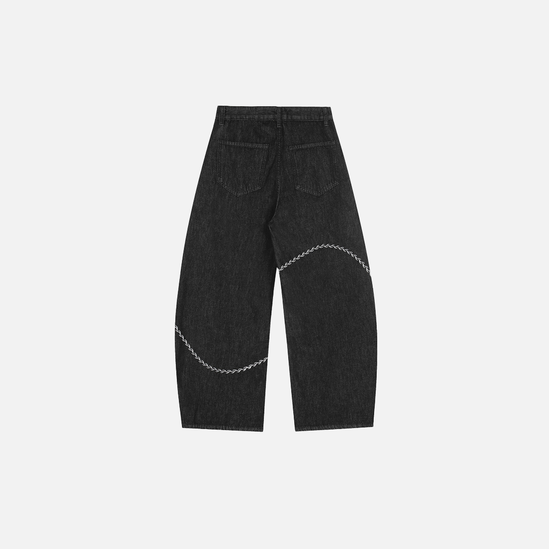 Einzigartige, bestickte Jeans mit unregelmäßigem, weitem Bein