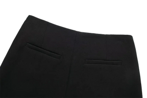 Close-up of black pants on a white background