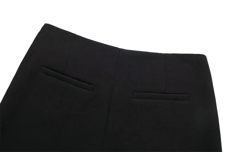 Close-up of black pants on a white background