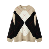 Beige, black, and white argyle pattern sweater on a white background
