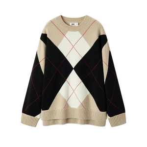 Beige, black, and white argyle pattern sweater on a white background