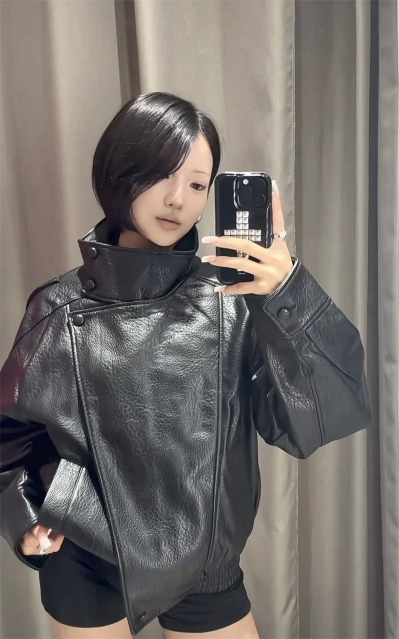 Style yourself in this oversized black leather jacket, featuring a chic high collar and elasticated hem for a sophisticated yet edgy streetwear look.