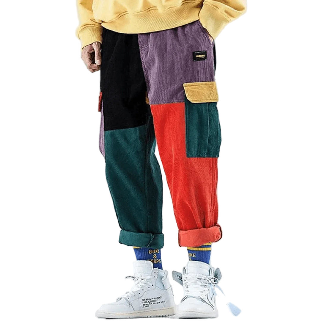 Colorful patchwork pants worn by a person on a plain background
