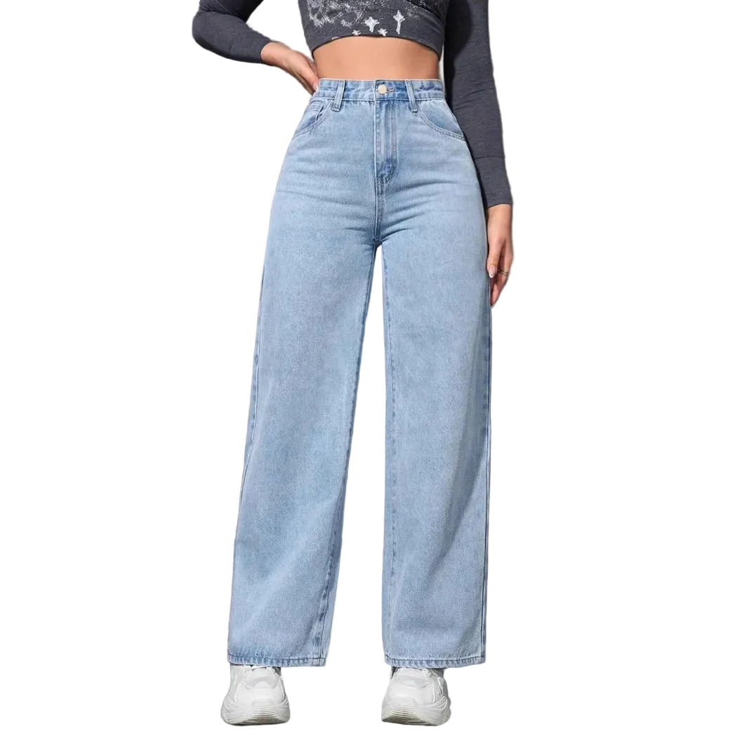 Person wearing light blue jeans against a gray wall