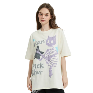 Woman wearing a cream t-shirt with a graphic design on a white background