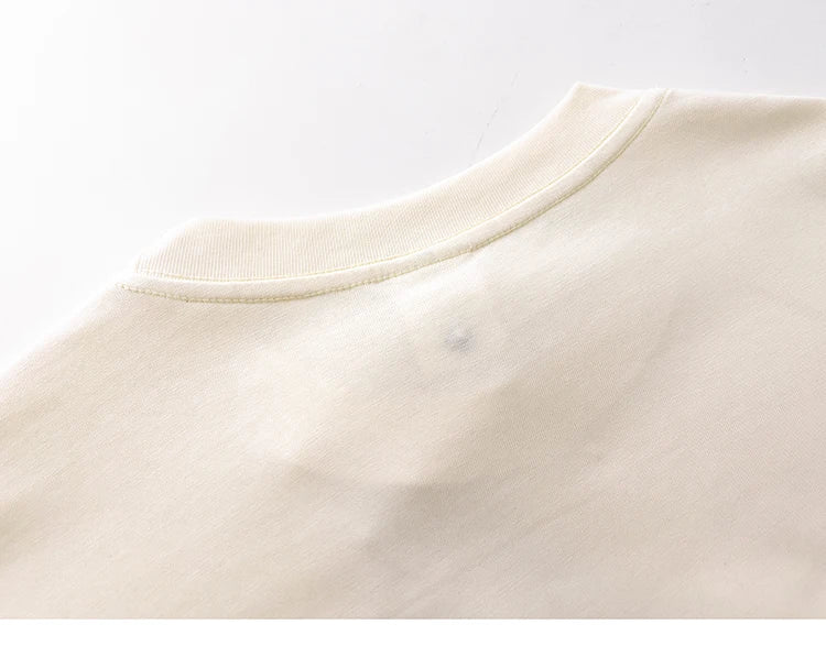 Close-up of a beige fabric texture on a white background