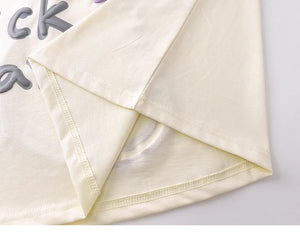 Close-up of a folded piece of fabric with a plain background