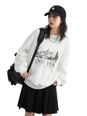Person wearing a white sweatshirt with text and graphics, black skirt, and black cap on a light gray background