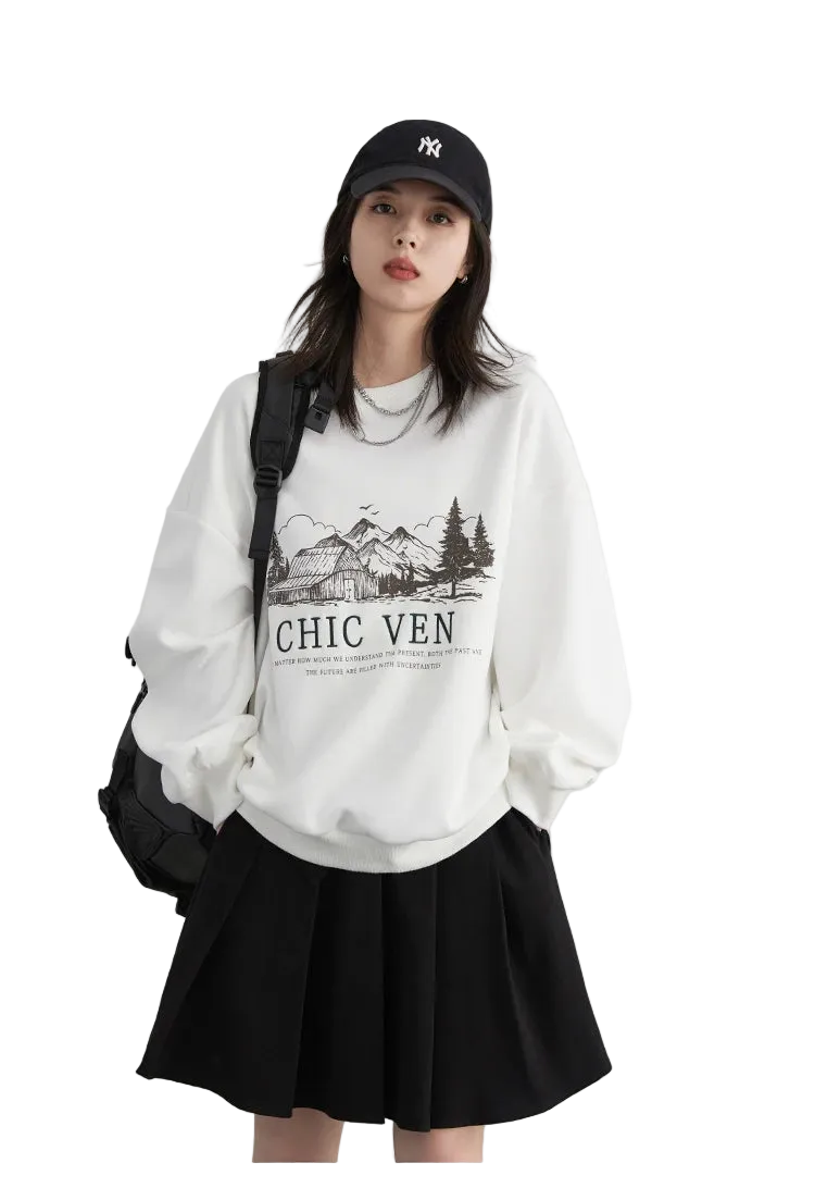 Woman wearing a white sweatshirt with text and graphics, black cap, and black skirt on a light gray background