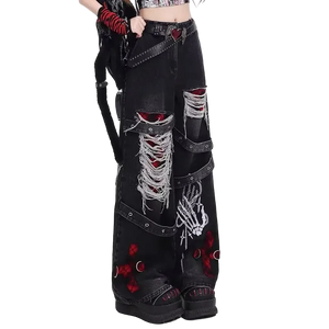 Black distressed jeans with decorative elements on a white background