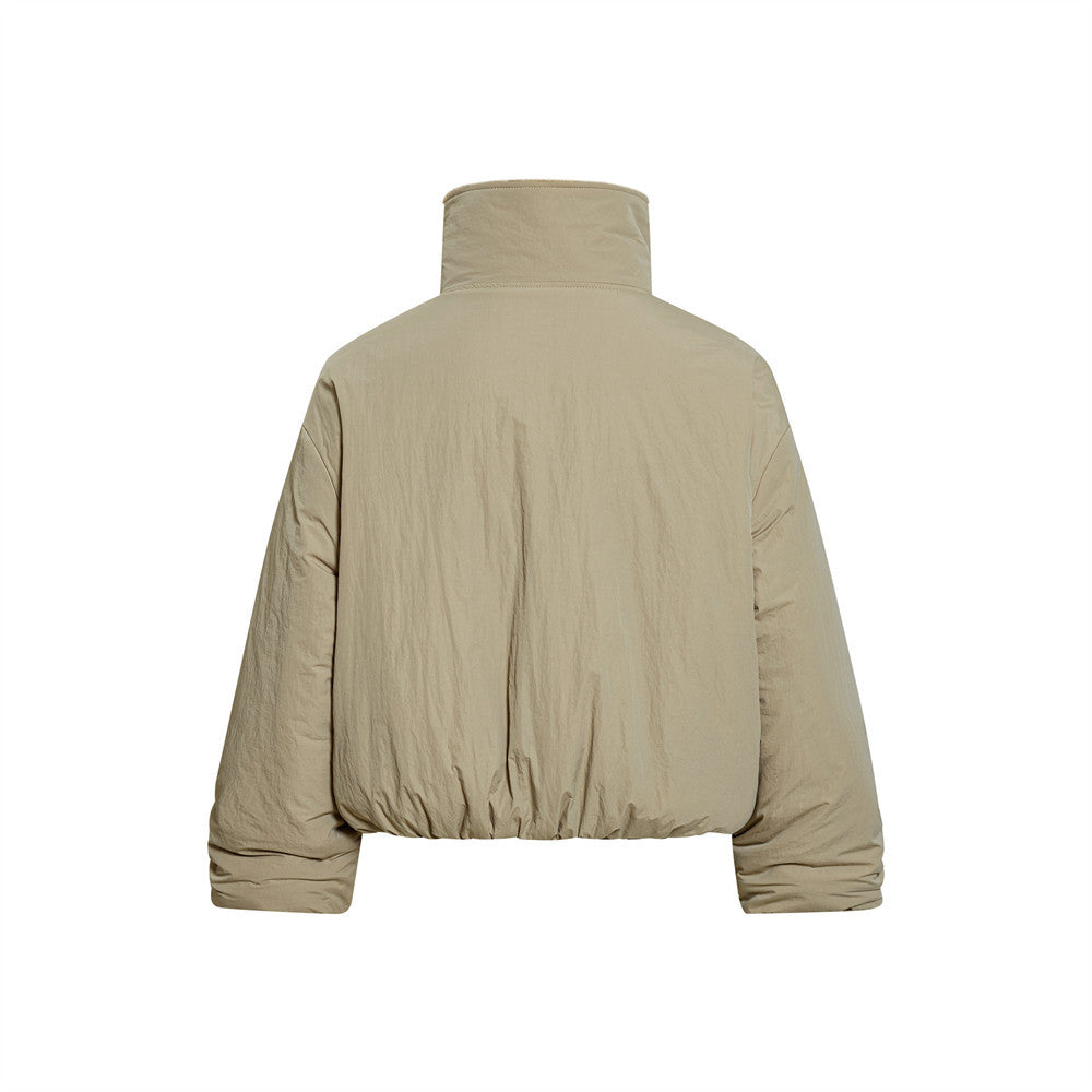 Beige puffer jacket on a white background