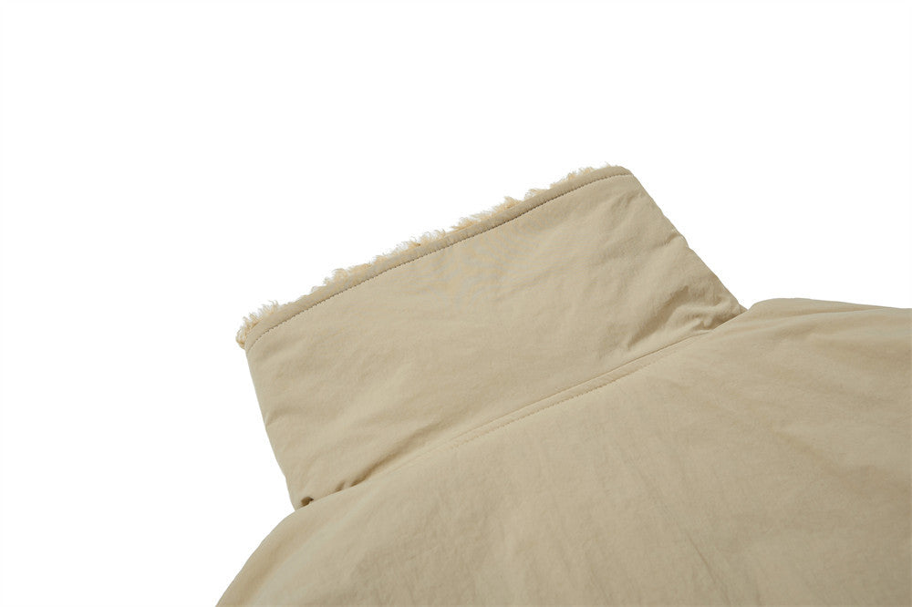 Beige quilted coverlet on a white background