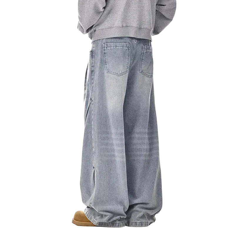 Person wearing light blue jeans and a gray sweatshirt on a white background